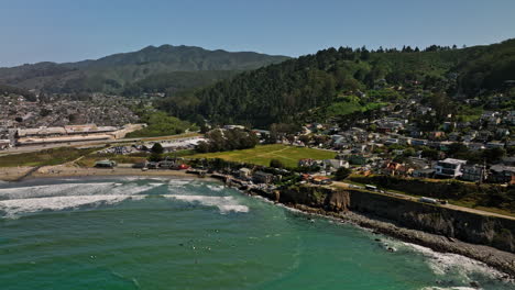 Pacifica-California-Aerial-v2-cinematic-drone-flyover-and-along-crescent-shaped-beach-shore-from-pedro-point-towards-linda-mar-neighborhood-on-a-sunny-day-in-summer---Shot-with-Mavic-3-Cine---May-2022