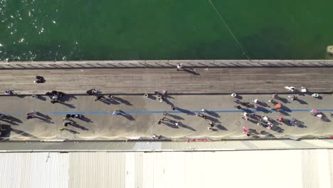 Top-dowv-shot-of-lots-of-families-with-children-on-the-Old-Tel-Aviv-Port-Promenade-#009