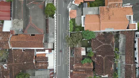 Aerial-top-shot-of-settlement-and-motorcycle-on-roads-in-the-city-of-Yogyakarta