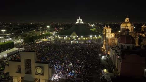 Aerial-view-over-pilgrims-camping-in-front-of-the-Basílica-de-Guadalupe,-Pilgrimage-Virgin-Day-night-in-Mexico-city