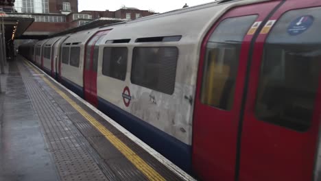 17-December-2022---Piccadilly-Line-Train-Departing-Platform-At-Rayners-Lane