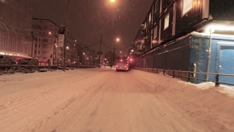 POV-shot-driving-in-heavy-traffic-in-downtown-Helsinki-at-night