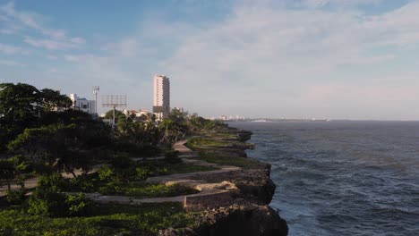 Aerial-forward-over-promenade-of-Malecon-coast-in-Santo-Domingo