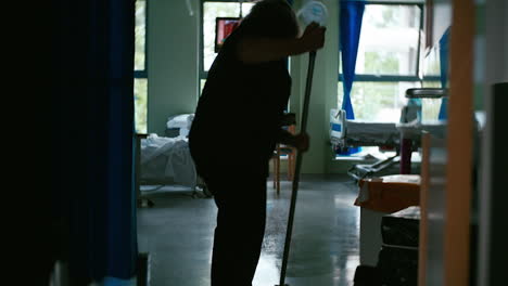 Hospital-staff-cleans-the-hospital-floor-with-mop