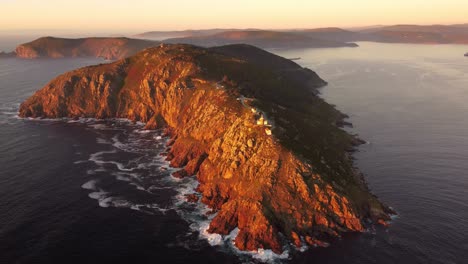Sunset-aerial-view-of-Cape-Finisterre-rock-bound-peninsula-on-the-west-coast-of-Galicia,-Spain