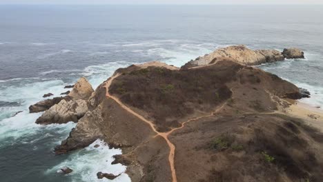 Pull-front-above-Punta-Cometa,-with-view-of-cliffs,-in-Oaxaca,-Mexico