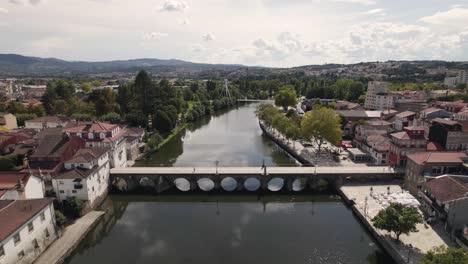 Aerial-Ascending-reveal-Chaves-cityscape-by-the-Tamega-River-and-Roman-Bridge---Portugal