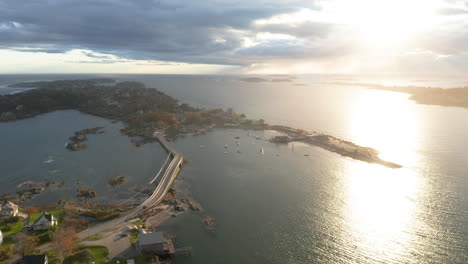 High-flying-drone-shot-of-Bailey-Island,-Maine-at-Sunset