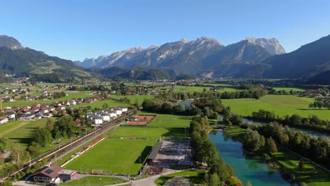 Wide-aerial-pull-in-towards-Austrian-alps-in-stunning-city-Kuchl-outside-Salzburg