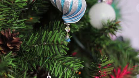 Glitter-foami-christmas-ornament,-hanging-from-the-christmas-tree