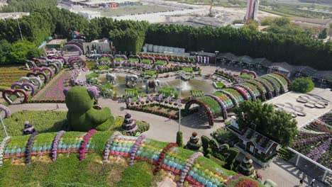 Drone-view-of-Miracle-Garden,-the-largest-natural-flower-garden-in-the-world-with-over-150-million-flowers-of-more-than-120-varieties