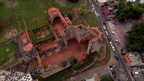 Aerial-top-down-orbiting-over-monastic-complex-ruins-of-San-Francisco,-colonial-zone-in-Santo-Domingo