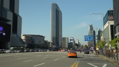 Establishing-street-view-of-Seoul,-South-Korea-with-the-Asem-Tower-ahead-and-the-Trade-Tower-to-the-left