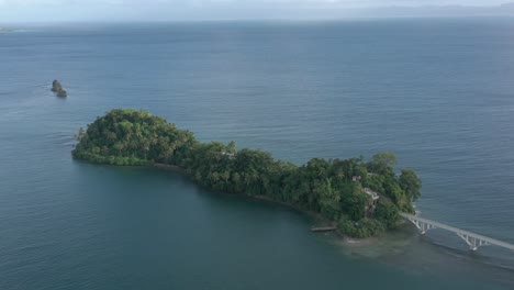Tropical-islet-and-footbridge-in-Samana-bay,-Dominican-Republic