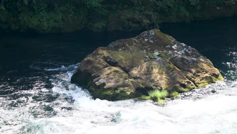 Boulder-Amidst-Flowing-River-At-The-Wilderness-On-Summer