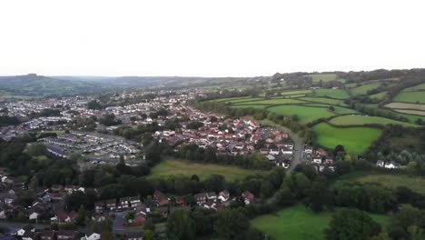 Aerial-backwards-shot-with-a-view-over-Honiton-in-Devon-England