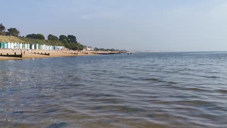 stokes-bay-beach-in-hampshire,-england-looking-calm,-sunny-and-wavy
