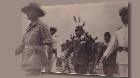 Seishiro-Itagaki-being-escorted-by-British-Army-and-Navy-officers-to-sign-the-surrender-terms