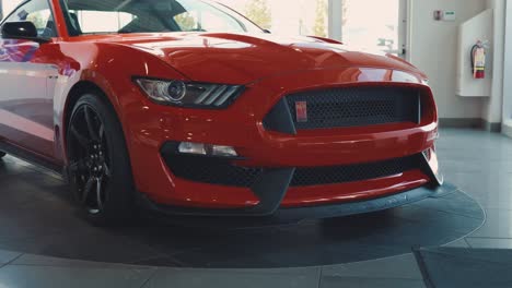 Red-Ford-Mustang-Shelby-Sitting-in-a-Dealership-Show-Room