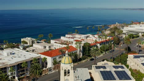 Aerial-view-over-a-tower-with-yellow-dome-in-La-Jolla,-California