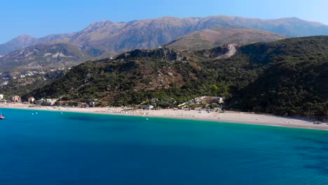 Beautiful-coastline-of-South-Albania-with-hills-and-mountains-above-blue-azure-sea
