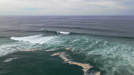 Boat-And-Waves-In-Sharpes-Beach---Skennars-Head,-NSW,-Australia---aerial-drone