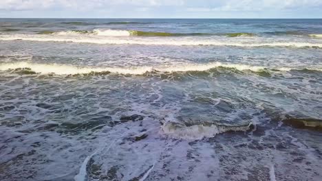 Sea-Waves-On-Sandy-Beach-Aerial-Slowmotion-Shot