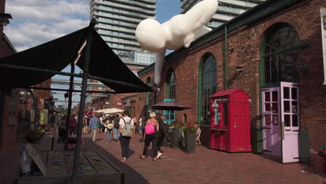 Wide-shot-of-people-enjoying-a-sunny-day-in-the-Distillery-District-of-Toronto
