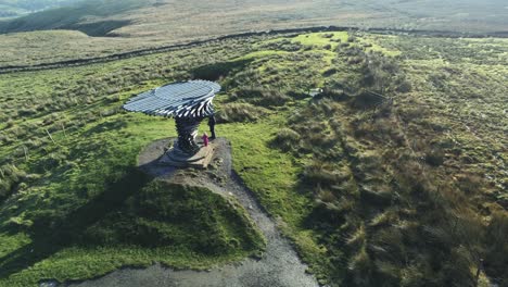 Aerial-singing-ringing-tree-musical-panopticon-sculpture-in-Lancashire-hiking-countryside-high-orbit-right