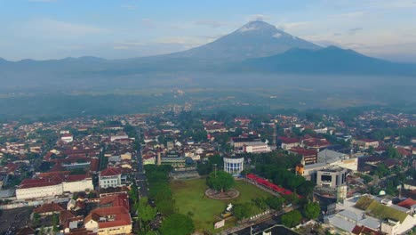 Aerial-panorama-of-downtown-Magelang-Indonesia-and-Mount-Sumbing-and-Merbabu