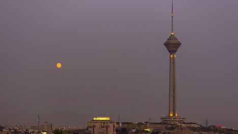 Moon-Rese-Over-Air-Pollution-on-Milad-Tower-in-Big-City-of-Tehran-in-Iran-Middle-East-in-Asia-in-Gray-Color-Sky-After-Sunset-twilight