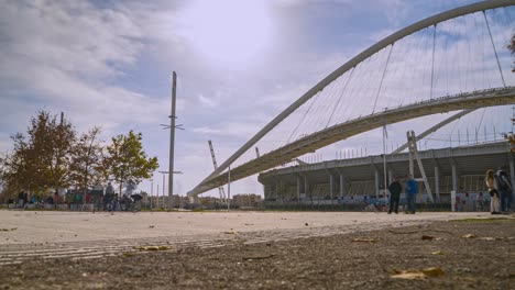 Timelapse-of-people-passing-by-at-facilities-of-OAKA,-olympic-athletic-center-of-Athens-,-Greece,-during-coronavirus-lockdown