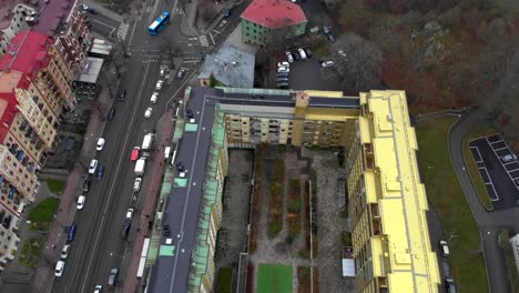 Aerial-view-of-modern-city-with-apartment-buildings-and-road-traffic