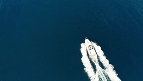 Above-luxury-yacht-in-pristine-calm-blue-water-of-Atlantic-Ocean,-aerial
