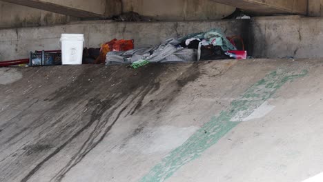 Empty-homeless-person-encampment-under-highway-over-pass-in-Corpus-Christi,Texas