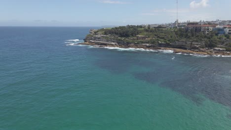Peninsula-Of-Mackenzies-Point-With-Calm-Blue-Sea---Seascape-At-Tamarama,-NSW,-Australia