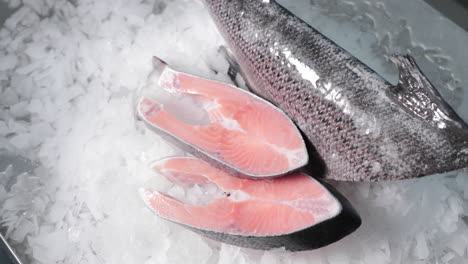 Close-Up-Shot-Of-Sliced-Salmon-On-Crushed-Ice---high-angle