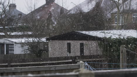 Snow-Falling-On-Residential-Back-Gardens-And-Garages-In-Harrow