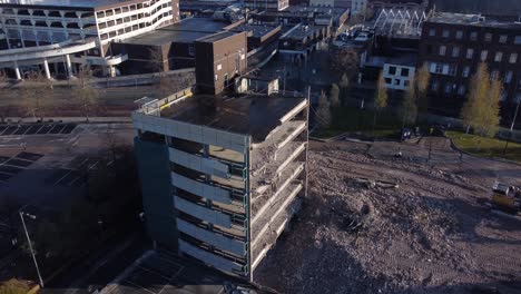 Multi-storey-car-park-concrete-demolition-debris-in-town-regeneration-aerial-view-across-site
