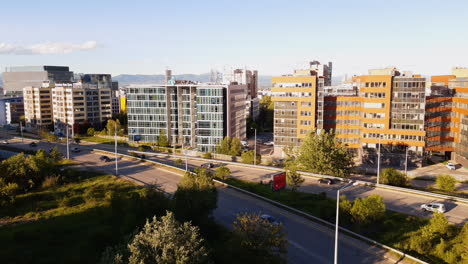 Business-park-Sofia-Bulgaria-and-traffic-on-Alexander-Malinov-boulevard-in-Mladost-4-on-a-sunny-day-during-Golden-Hour