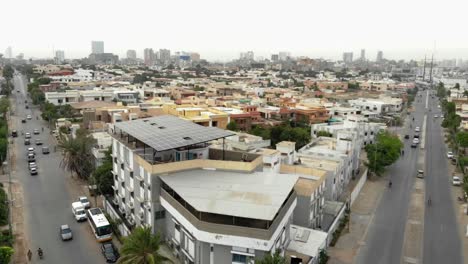Aerial-View-Of-Karachi-Rooftop-Skyline-With-Building-With-Solar-Panels-On-Top