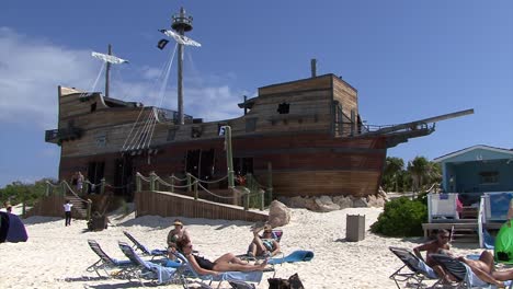 Beach-bar-in-the-shape-of-a-sail-ship-on-the-beach-of-Half-Moon-Cay,-Bahamas