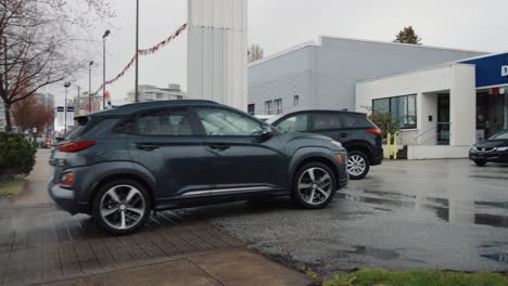 Panning-Shot-of-a-Hyundai-Small-SUV-Pulling-into-a-Dealership