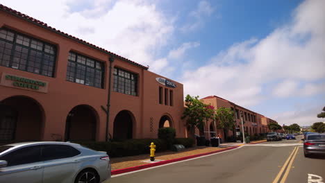 Conduciendo-A-Lo-Largo-De-Truxtun-Road-En-El-Distrito-Residencial-De-La-Estación-Liberty-En-San-Diego,-California-Pasando-Por-Edificios-Comerciales-Cuando-Hace-Buen-Tiempo