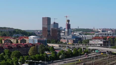 View-Of-Garda-Business-Center,-Known-As-Canon-Building,-From-Marieholmsgatan-In-Gothenburg,-Sweden-With-Ullevi-Stadium-In-Distance