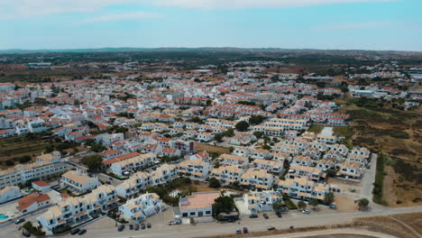 Bird's-Eye-View-Of-Vacation-Houses-At-The-Coastline-Of-Altura-In-Algarve,-Portugal-In-Summer