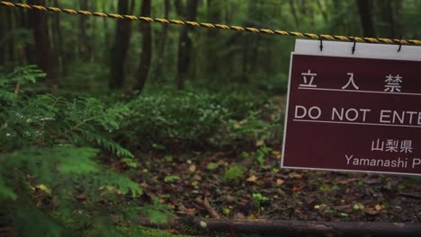 Forbidden-Forest,-Aokigahara-with-"Do-Not-Enter"-sign-in-Yamanashi-Japan