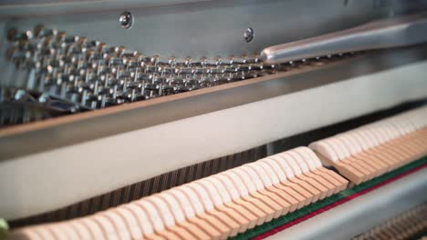 Gary-Pons-see-through-mechanical-piano-mechanism-close-up,-Pan-right-detail-shot