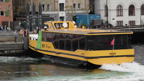 Copenhagen-Harbour-Bus-In-Nyhavn---Yellow-Electric-Harbour-Bus-Nyhavn-At-Terminal-In-Copenhagen,-Denmark