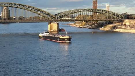 A-cargo-ship-on-the-River-Rhine-at-Cologne-near-the-Hohenzollern-Bridge